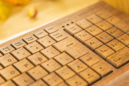 Closeup view at the old wooden computer keyboardの写真素材