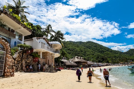 PUERTO VALLARTA, MEXICO - SEPTEMBER 10, 2015: Unindentified people at Playa Las Animas in Mexico. It is a beautiful beach in the southern zone of Puerto Vallarta.のeditorial素材