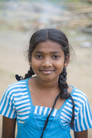 MATALE. SRI LANKA - JANUARY 27, 2014: Unidentified schoolgirl at the street of Matale, Sri Lanka. At Sri Lanka Education is state funded and offered free of charge at all levels.のeditorial素材