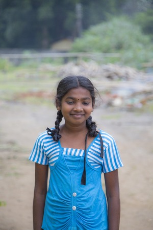 MATALE. SRI LANKA - JANUARY 27, 2014: Unidentified schoolgirl at the street of Matale, Sri Lanka. At Sri Lanka Education is state funded and offered free of charge at all levels.のeditorial素材