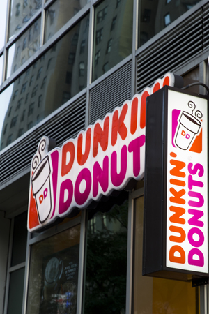 NEW YORK, USA - AUGUST 31, 2017: Detail of the Dunkin Donuts store in New York. It is an American global donut company and coffeehouse founded at 1950.のeditorial素材