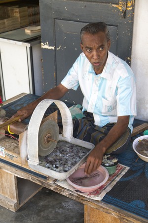 GALLE, SRI LANKA - JANUARY 24, 2014: Unindentified man doing traditional gem ppolishing in Galle, Sri Lanka. The gem and jewellery industry has been an important part of Sri Lankas economy.のeditorial素材