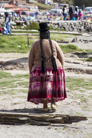 Unindentified woman on the street of Copacabana, Bolivia.の写真素材