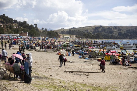 COPACABANA, BOLIVIA - JANUARY 6, 2018: Unindentified people on lake Titicaca shore in Copacabana, Bolivia. Copacabana is the main Bolivian town on the Lake Titicacaのeditorial素材