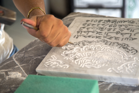 FES, MOROCCO - SEPTEMBER 15, 2014: Unindentified man doing traditional carving in workshop at Fes medina in Morocco.のeditorial素材