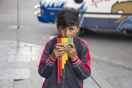 LA PAZ, BOLIVIA - JANUARY 12, 2018: Unidentified boy with pan flute at street of La Paz, Bolivia.のeditorial素材