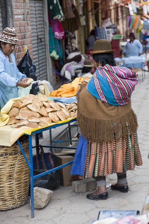 COPACABANA, BOLIVIA - JANUARY 6, 2018: Unindentified woman on the street of Copacabana, Bolivia. Copacabana is the main Bolivian town on the Lake Titicacaのeditorial素材