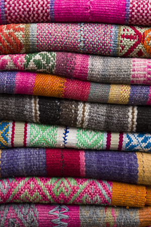 Colorful traditional peruvian fabrics on the market in Cusco, Peruの写真素材