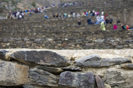 Tourists visiting Colossal Sanctuary of Ollantaytambo in Peruの写真素材