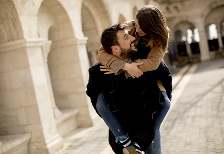 Walk of the pretty loving couple happily walking and having fun in Budapest, Hungaryの写真素材