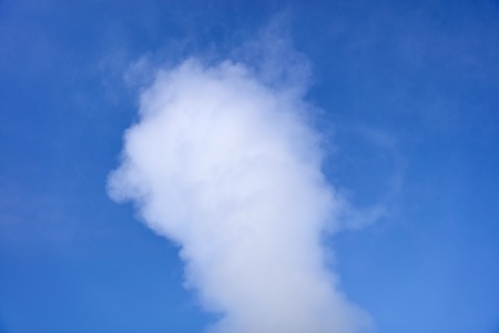 View at geyser steam eruption under the blue skyの写真素材