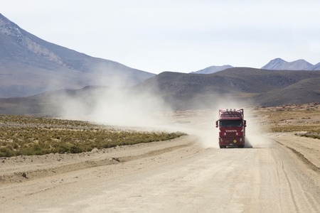 BOLIVIA - JANUARY 14, 2018: Truck on the unpaved road in Bolivia. At 2004 more than 92% of roads in Bolivia were unpaved.のeditorial素材