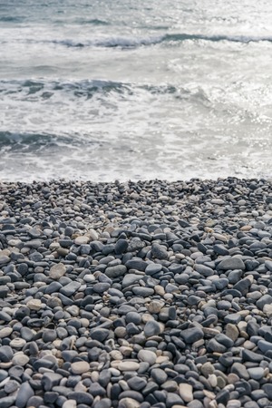 Detail of the cobble stone beach and seaの写真素材