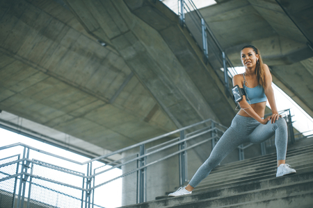 Young woman exercise in urban enviromentの写真素材