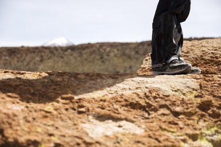 Closeup of the hiker shoes on the mountainの写真素材