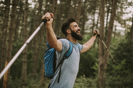 Side view at young bearded hiker in mountainの写真素材