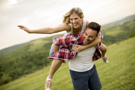 Young loving coulpe having fun in the spring natureの写真素材