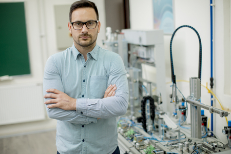 Handsome young man in the electronic workshop