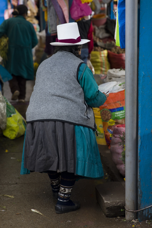 CUSCO, PERU - JANUARY 2, 2018: Unidentified woman on the San Pedro Market in Cusco, Peru. Markets play very important part of todays culture in Peru.のeditorial素材