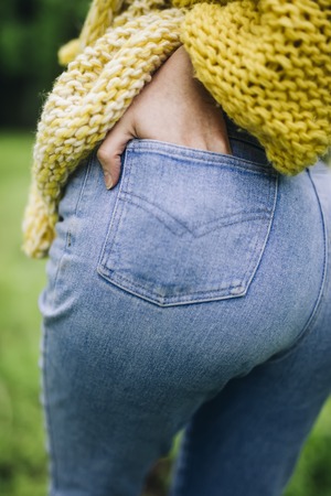 Fit slim female butt in blue jeansの写真素材