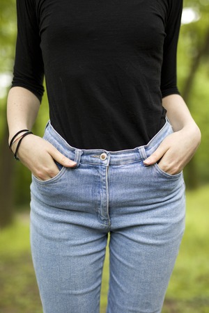 Womens hips in denim at outdoorsの写真素材