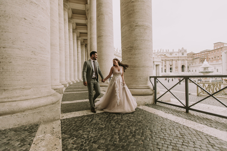 Young wedding couple in Vatican, Rome, Italyの写真素材