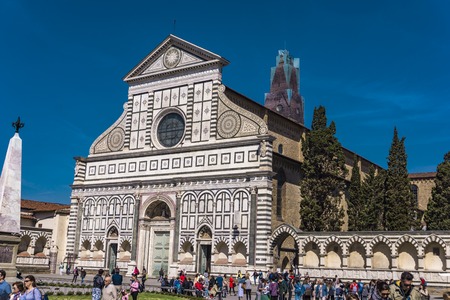 FLORENCE, ITALY - APRIL 6, 2018: Unidentified people by Basilica of Santa Maria Novella in Florence, Italy. It is an Dominican 15th century church.のeditorial素材