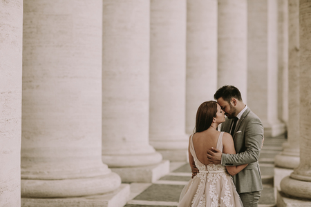 Young wedding couple in Vatican, Rome, Italyの写真素材