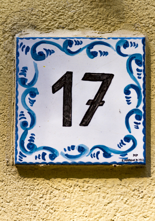 PORTOFINO, ITALY - APRIL 29, 2017: Decorative street number plate from Portofino, Italy. Portofino is one of the most popular resort towns on the Italian Riviera.のeditorial素材