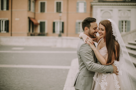 Young wedding couple on Spanish stairs in Rome, Italyの写真素材