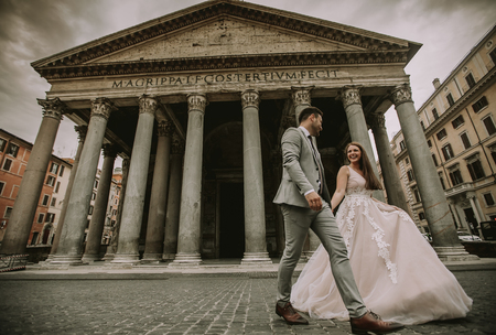 Lovely young wedding couple by Pantheon in Rome, Italyの写真素材