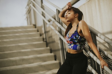 Portrait of female runner restingの写真素材