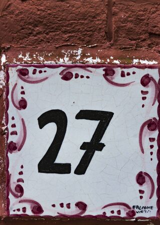 PORTOFINO, ITALY - APRIL 29, 2017: Decorative street number plate from Portofino, Italy. Portofino is one of the most popular resort towns on the Italian Riviera.のeditorial素材