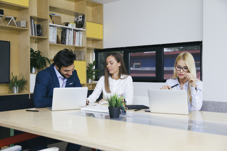Group of young business people working in the officeの写真素材