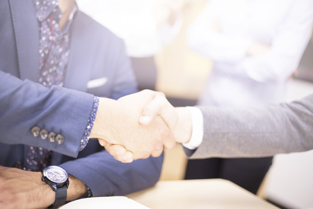 Closeup of a businessmen  handshake when finishing up a meetingの写真素材