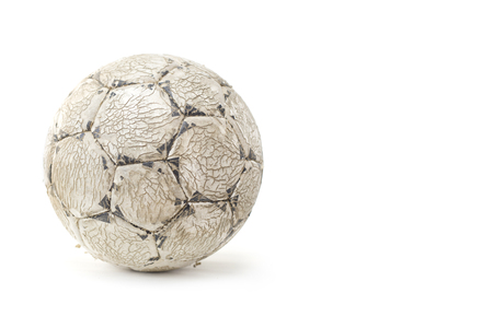 Old worn soccer ball isolated on the white backgroundの写真素材