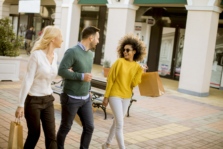 Group of young multiracial friends shopping in mall togetherの写真素材