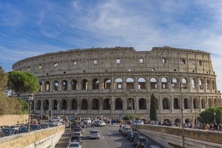 ROME, ITALY- SEPTEMBER 22, 2018: Unidentified people by Colloseum in Rome, Italy. It is most...
