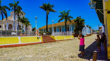 TRINIDAD, CUBA - MAY 25, 2014: Unidentified people on Plaza Mayor at Trinidad, Cuba. Trinidad has been a UNESCO World Heritage site since 1988.のeditorial素材
