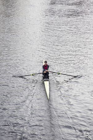 HANOVER, GERMANY - OCTOBER 27, 2018: Unidentified woman rowing in Hanover, Germany. Thanks to the Maschsee lake, the rivers Ihme and Leine Hanover hosts many rowing clubs.のeditorial素材