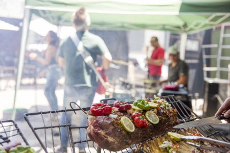 BUENOS, AIRES, ARGENTINA - JANUARY 21, 2018: Food preparation on market stall at San Telmo flea...