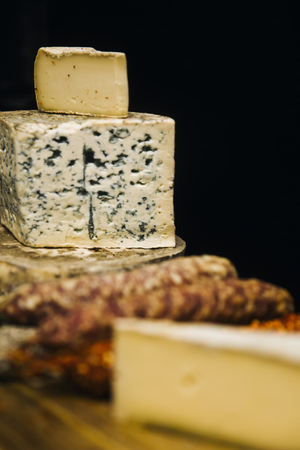 Variety of french dried sausages and cheese from Auvergne on the wooden tableの写真素材