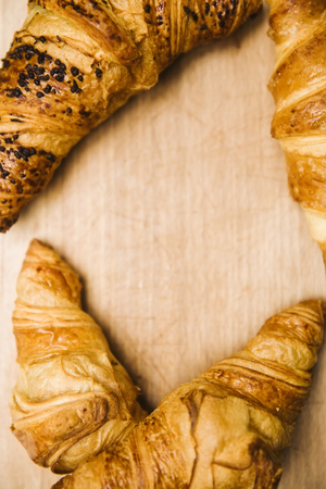Fresh Croissants on a rustic woodenの写真素材