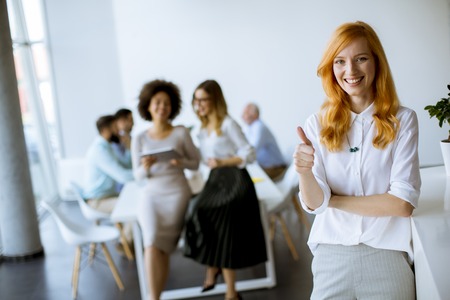 Successful  business people discussing documents and working in modern officeの写真素材