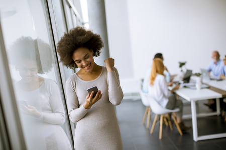 Portrait of a young African American  businesswoman using mobile phoneの写真素材