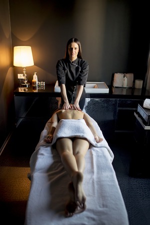 Young woman having a massage in the wellness centerの写真素材