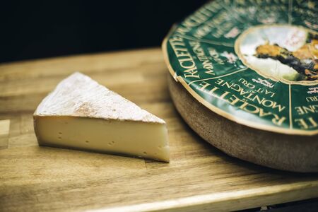 BELGRADE, SERBIA - NOVEMBER 22, 2018: Detail of Raclette de Montagne cheese in Belgrade, Serbia. Raclette is a semi-hard cheese made from cow milks from Alps.のeditorial素材