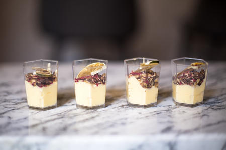 Delicious vanilla mousse dessert in the cupsの写真素材