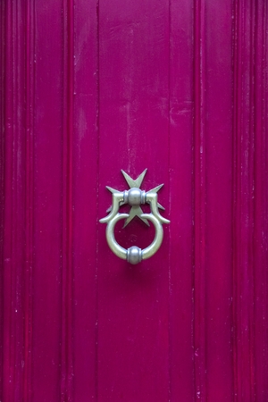 Decorative door knocker on a wooden door from Maltaの写真素材