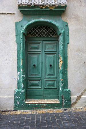 View at traditional front door from building on Maltaの写真素材